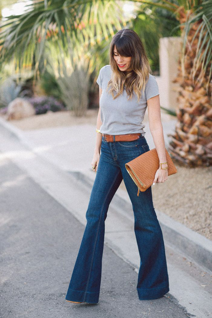 tucked tops with high-waist jeans  How to wear high waisted jeans, High  waisted flare jeans, High wasted jeans outfit