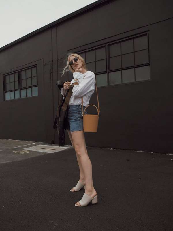 Outfit ideas: Denim shorts, white button up and beige mules on taylr anne