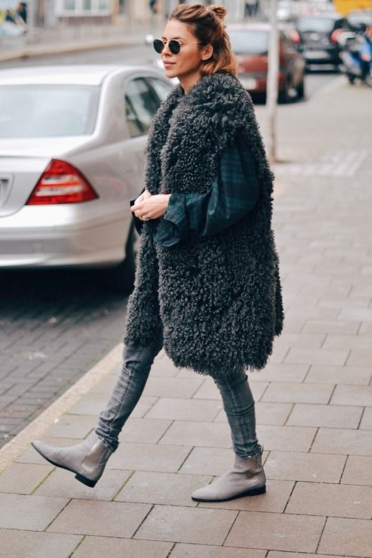 How-to Wear Casual Winter Layers like a Pro via @stylereportmag We love how fashion it girl Maja Wyn rocks a seriouly oversized faux fur vest and skinny jeans with flat leather boots