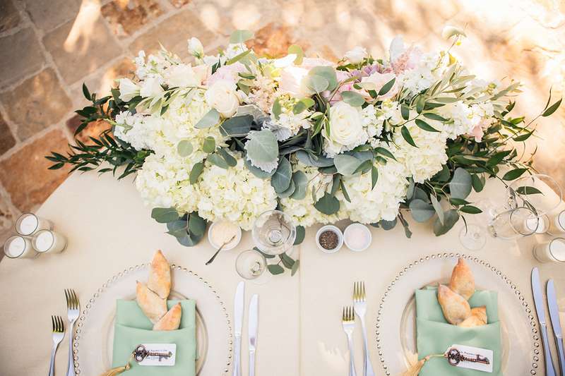 Sweethearts table florals and place settings. Pastel wedding colors for a spring wedding