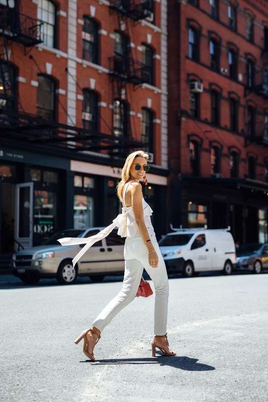 Simple chic white outfits to copy: a flirty white blouse paired with white denim and neutral accessories