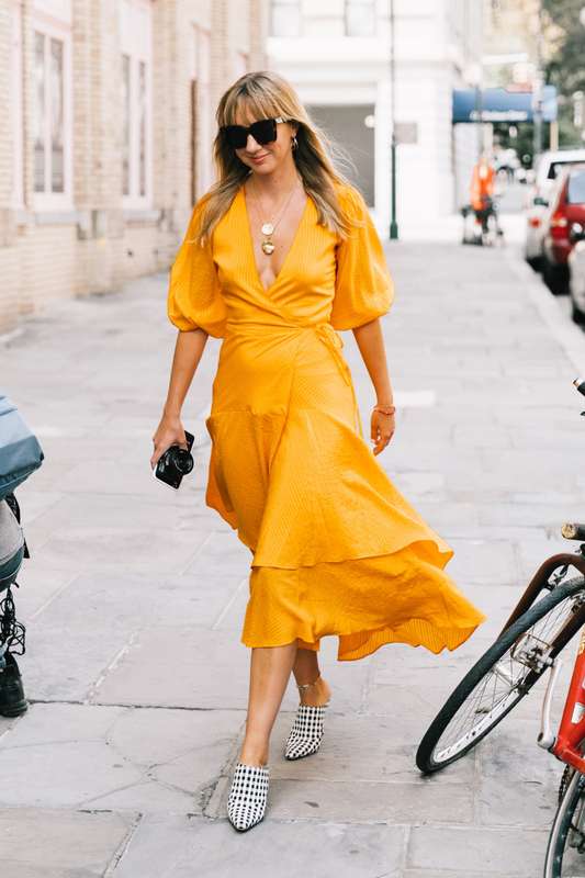 Bold Color Outfit Ideas must include this marigold wrap dress. Pair your solid bold color dress with a statement shoe like a gingham mule