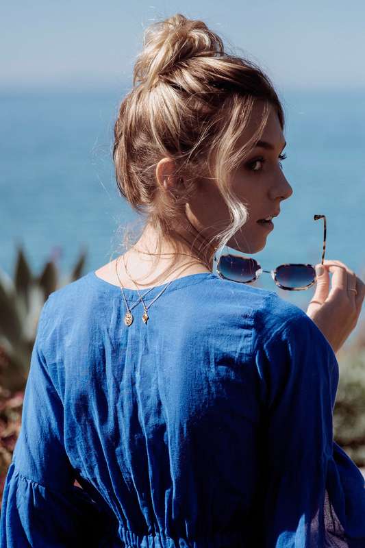 Style trick to add a little back detail: wear your layered necklaces down your back instead of in front