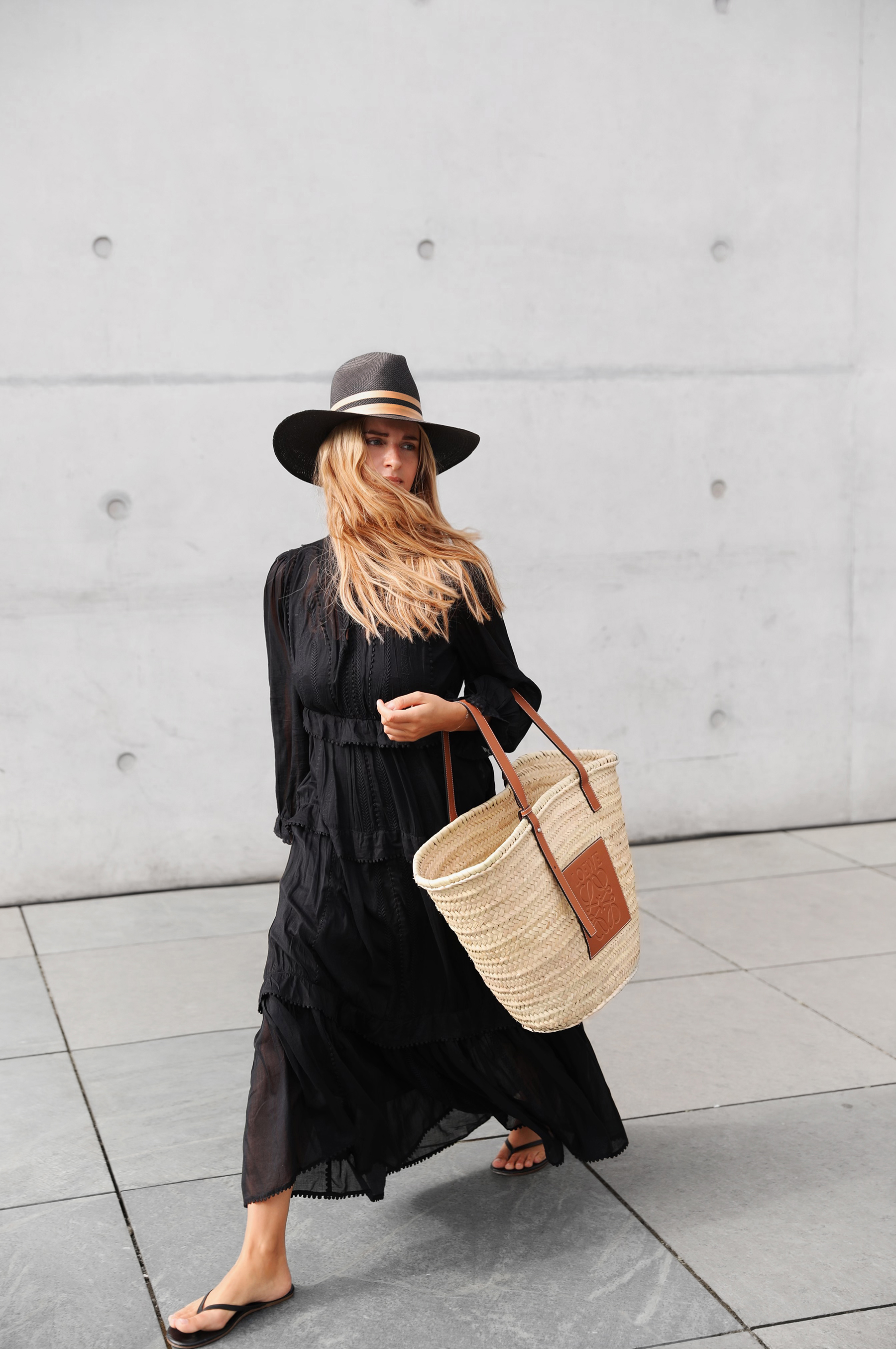 neutral summer outfits Minimal Summer Outfit Ideas Neutral Outfit Ideas Black Long Sleeve Maxi Dress Straw Hat Straw Tote Bag Woven Accessories 